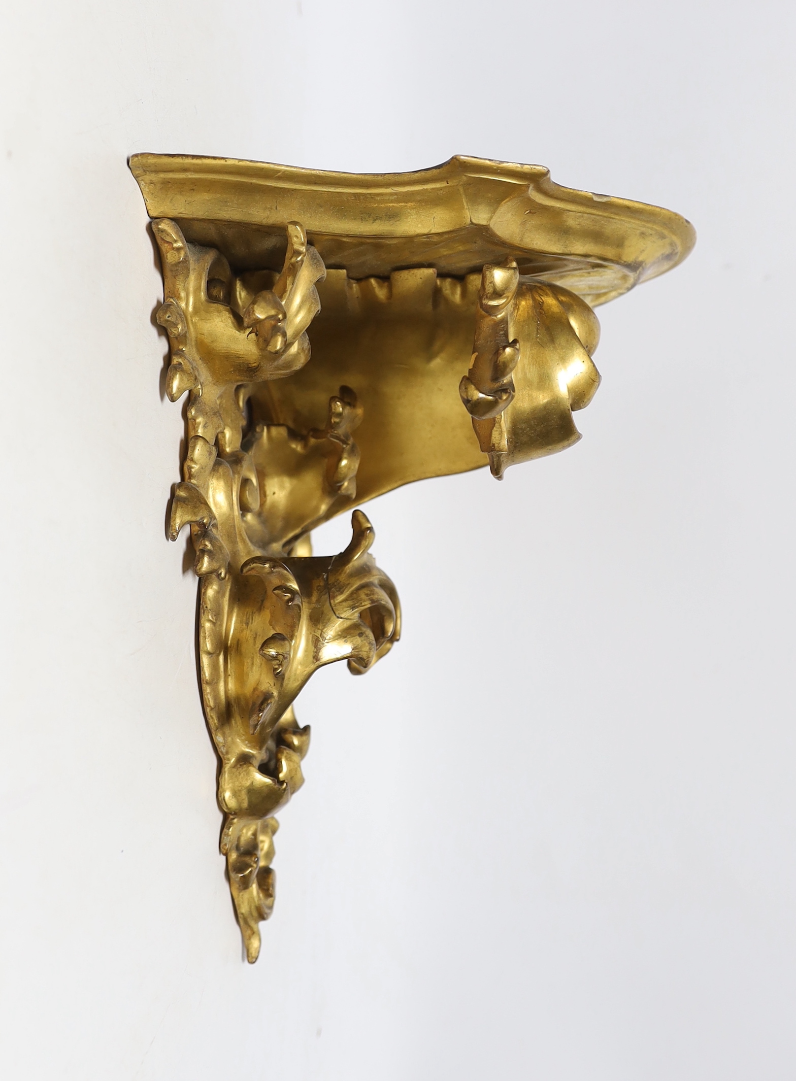 Two late 19th century Florentine rococo style giltwood wall brackets, largest 27cm long